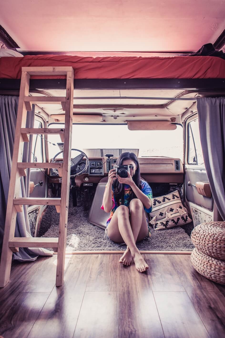 girl taking photo inside Van house 